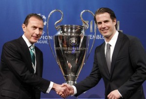 Real Madrid CF International Relations Director Butragueno shakes hand with Borussia Dortmund former player Ricken after the draw for the Champions League semi-finals matches at the UEFA in Nyon